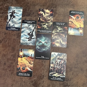 May include: A spread of ten tarot cards with various illustrations, including a frog, a lantern, a door, and a mountain. The cards are laid out in a circle on a brown surface.