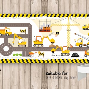 May include: A yellow and black construction themed vinyl play mat with a road, construction vehicles, and a crane. The mat is 114.5 cm wide and is suitable for the IKEA DUNDRA play table.