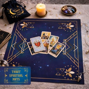 May include: A navy blue tarot mat with gold geometric designs and a starry background. Several tarot cards are displayed on the mat, along with a small velvet bag, a candle, and a bowl of crystals. The mat has the text "Tarot Spiritual Mats".