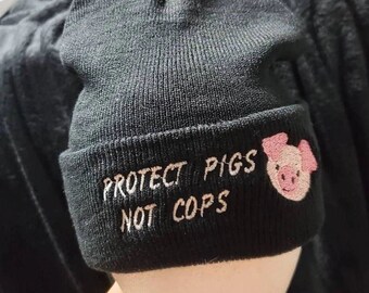 Protect pigs not cops Beanie