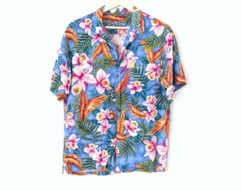 blue hawaiian shirt. Island paradise Hawaii top with pink Hibiscus and real coconut buttons.