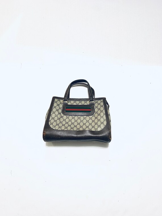 1970's GUCCI handbag. Brown vinyl, leather trimmed