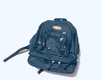 Durable Black vintage backpack. Clean Nylon backpack with multiple functional compartments and padded back. Medium size.