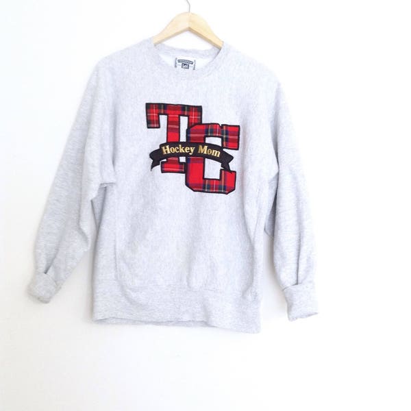 Vintage heather grey graphic print thick warm, oversized cotton sweatshirt. 90's TC hockey mom sweatshirt. Made in USA. Size large.