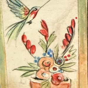 May include: A watercolor painting of a hummingbird and flowers in a vase. The hummingbird has green, blue, red, and yellow feathers. The flowers are red, orange, and blue, and the vase is orange.
