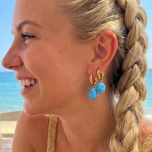 May include: A rustic wooden sign with the text "Welcome to our home" in white lettering. The sign has a distressed finish and a simple, inviting design, suitable for a front porch or entryway.