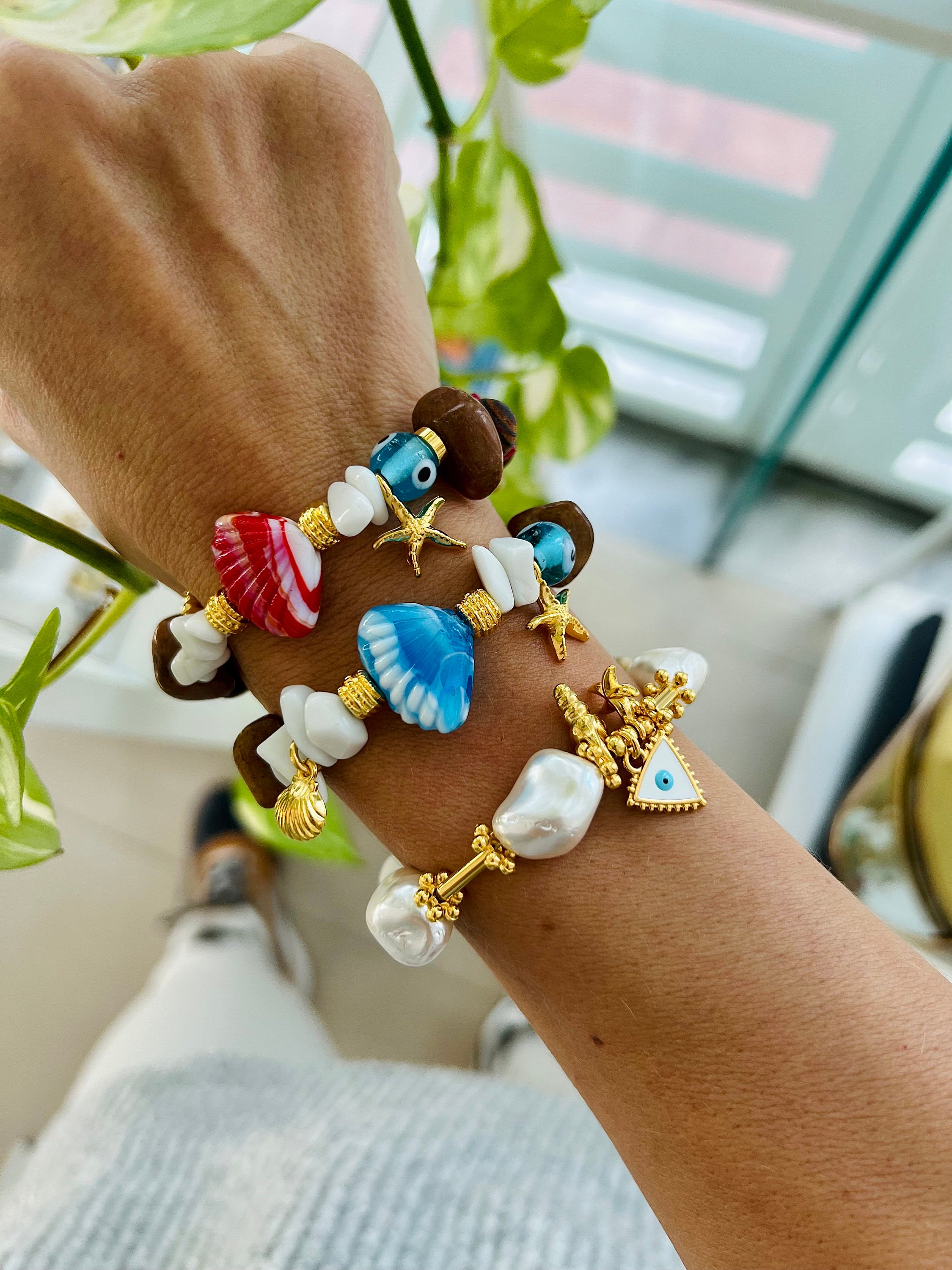 Braccialetti con conchiglie di stelle marine e perle da donna