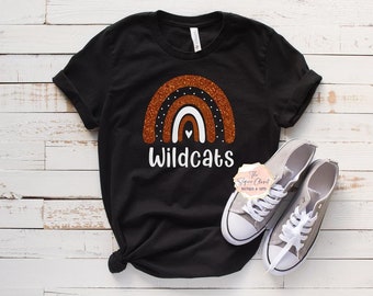 May include: Black t-shirt with an orange glitter rainbow and the text "Wildcats" in white.