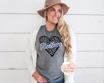 May include: Gray t-shirt with a black and white leopard print heart with the word "Panthers" in blue lettering.
