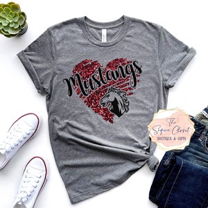 May include: Gray t-shirt with a red glitter heart that says "Mustangs" with a black horse silhouette inside the heart.