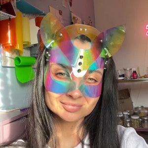 Rainbow cat mask, LGBTQ+ festival, pride cat, rainbow holographic costume, pale goth, anime girl, maskquerade cosplay, cyber animal, rave