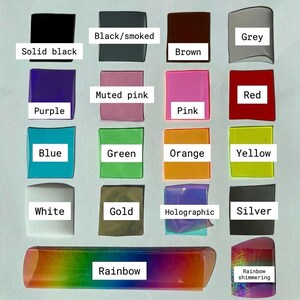 May include: A collection of colorful, translucent rectangular shapes, each labeled with a color name. Colors include solid black, black/smoked, brown, grey, purple, muted pink, pink, red, blue, green, orange, yellow, white, gold, holographic, silver, rainbow, and rainbow shimmering.