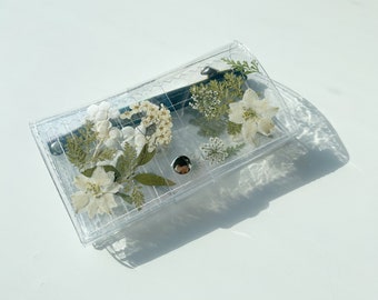 Clear vinyl wallet with pressed white delicate pressed flowers and greenery, 12 card slots, 2 bills pocket, 1 coin zipper wallet, vegan