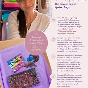 May include: A cardboard box containing a clear vinyl wallet filled with multicolored glitter, a pink vinyl keychain with a metal clasp, a holographic thank you card with a heart, and a dolphin-shaped sticker on purple tissue paper.