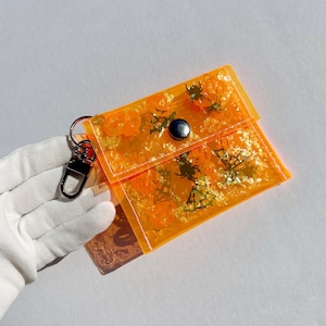 Spuktakelhaftes Oranges Vinyl Portemonnaie mit Glitter & Konfetti - Perfekt für Halloween Spaß!