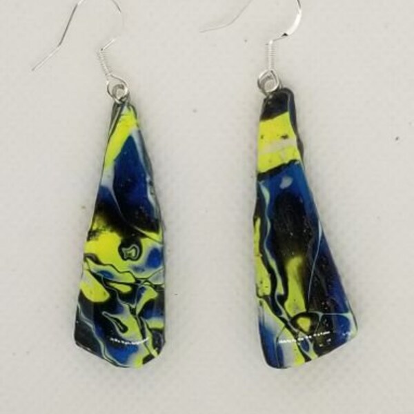 Dangly# polymer clay earrings in yellow, blue, and black. Sterling silver ear wires, resin finish.