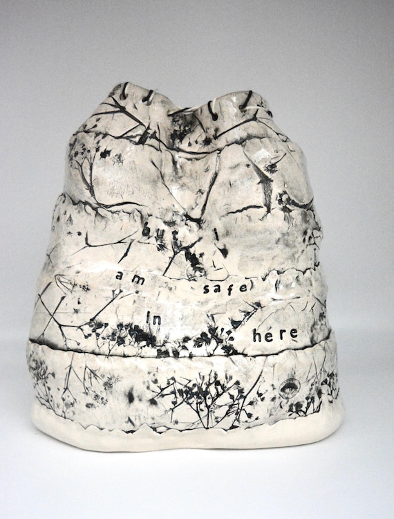 Textured clay sculpture with actual botanical imprints and hand-pressed words — tactile, literary, and looks nothing like anything at a big-box store.