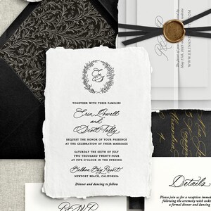 May include: Black and white wedding invitation with a gold wax seal. The invitation features a floral wreath with the initials "E&S" and the text "Erin Lowell and Scott Tally". The invitation also includes the date and time of the wedding, the location, and the RSVP information.
