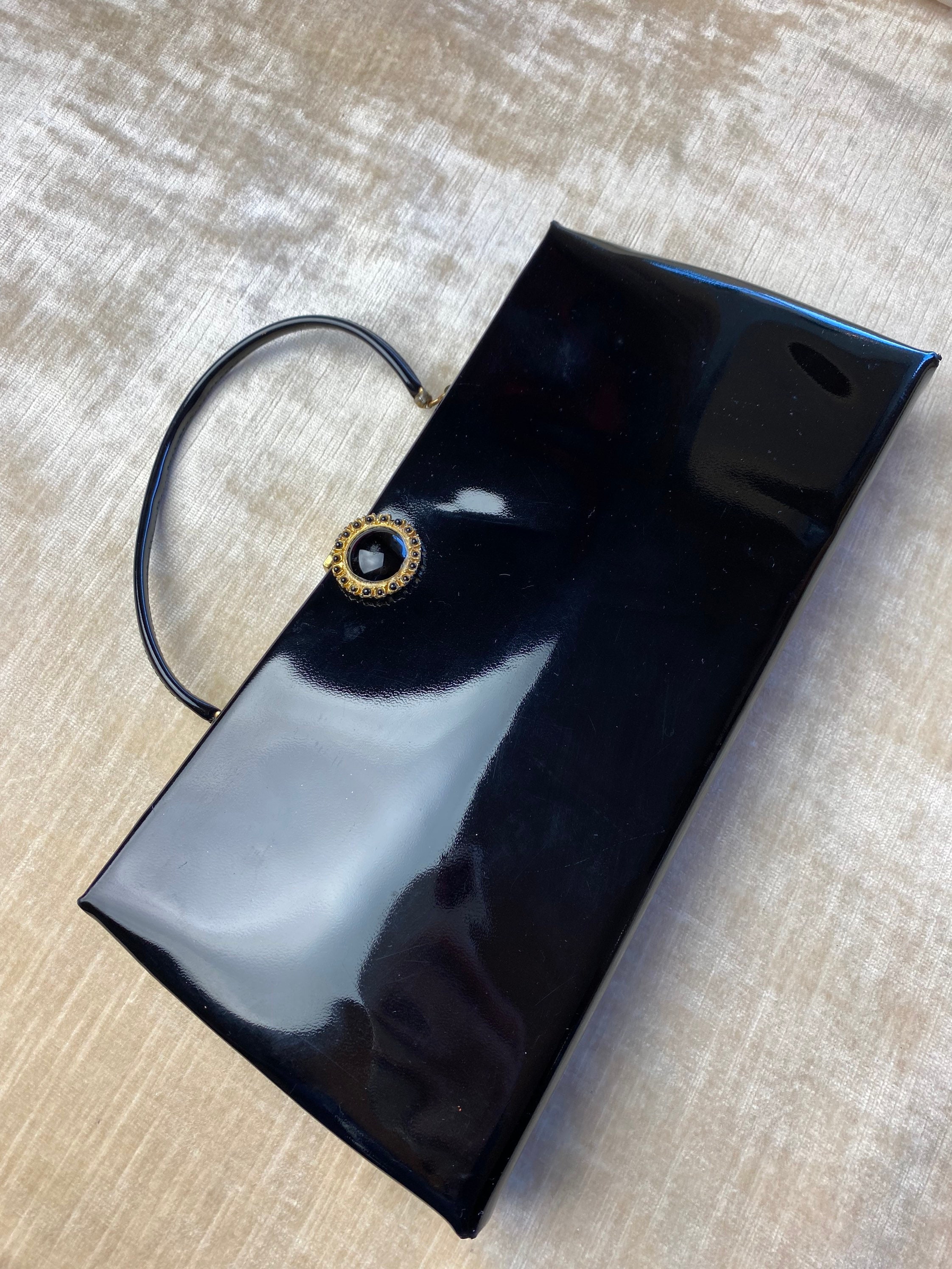 Borsa pochette vintage in vernice nera lucida elegante magra