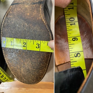May include: Close-up of the inside of a black leather shoe with a brown leather insole. A yellow measuring tape is placed inside the shoe, showing a measurement of 9 inches.