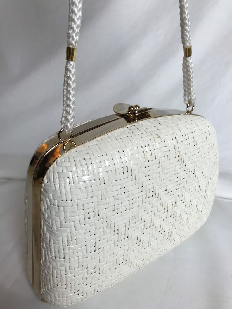 70s White woven wicker basket purse shiny gold accent clasp lacquered long roped straps clam style minimalist mod retro 1960s 1970s image 1