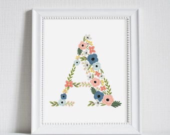 May include: A white frame with a white mat and a white background. The letter A is formed with a variety of blue, pink, and yellow flowers.