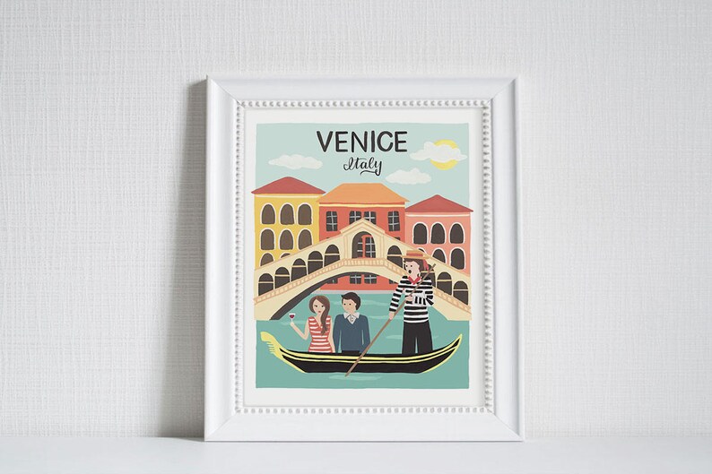 May include: Framed art print featuring a colorful illustration of Venice, Italy. The image shows a gondola with passengers, a gondolier, and the Rialto Bridge. The text "Venice Italy" is at the top.