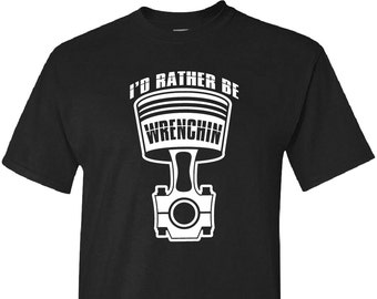 May include: Black t-shirt with a white graphic of a piston and the text "I'd rather be wrenchin'"