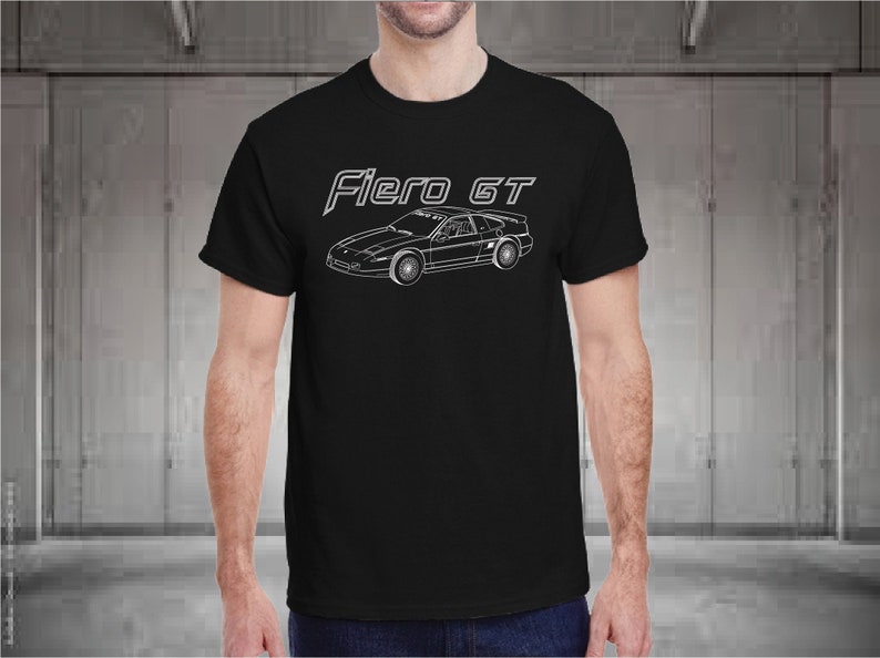 May include: Black t-shirt with a white outline of a Fiero GT car and the text "Fiero GT" in white.