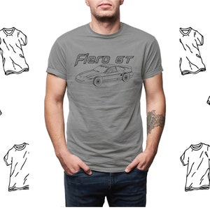 May include: A heather grey t-shirt with a black outline of a car and the text "Fiero GT".