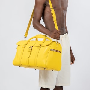 Yellow leather duffle bag hot sale