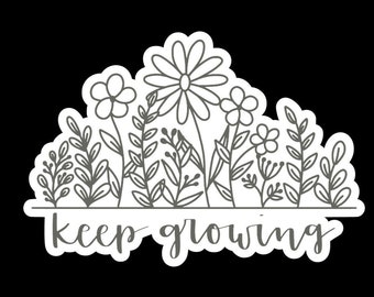 May include: Black and white line art illustration of a garden with flowers and leaves. The text "keep growing" is written below the garden.