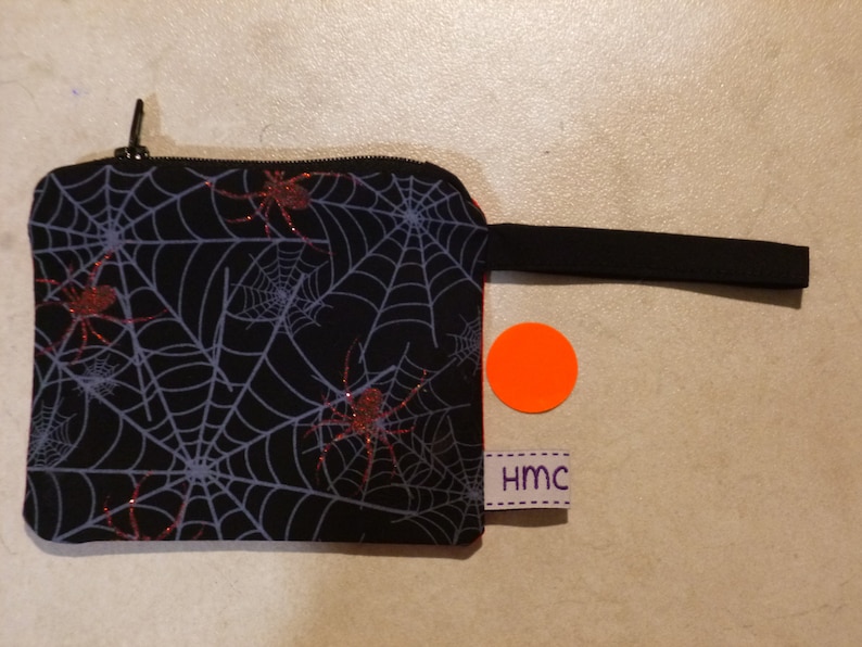 Mini zippered bag Fully lined Ideal for coins lipstick,etc. 11cm x 9cm approx Washable Checkered lining Sparkle Spiders print