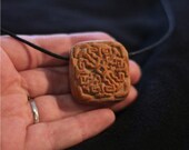 Double-sided pendant, Aztec patterns, medallion of clay