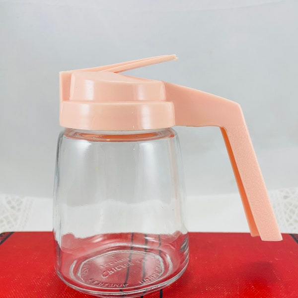 Vintage clear glass syrup dispenser with pink plastic top, Mid Century Modern syrup dispenser, made in USA by Federal Housewares, Chicago