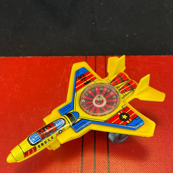 Vintage Jimmy toy airplane, 1980's, yellow F 15 Eagle Jet Fighter plane, tin and plastic, spinning top, very collectible, very clean