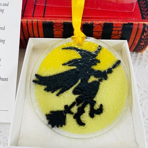 Vintage Peggy Karr round glass Halloween ornament/sun catcher, 3&quot; across, black witch on broom, yellow background, collectible