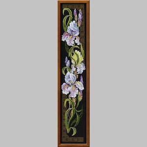 May include: A framed cross-stitch embroidery featuring a vertical arrangement of purple and white irises with green leaves on a black background.