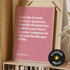 May include: A pink printable poster with a white inspirational quote that reads "Find the beauty in every moment, cherish the journey, and let your heart be your compass in the vast landscape of life." The quote is attributed to Elara Bennett. The poster also has a black circle with a yellow star and the text "CUSTOM PRINT".