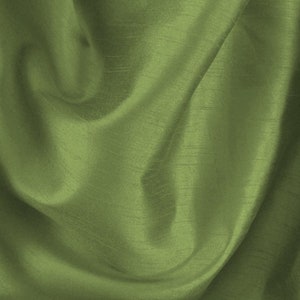 May include: A close-up of a smooth, green fabric with a subtle sheen. The fabric is draped and folded, creating soft curves and folds.
