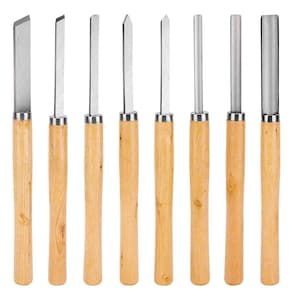 May include: A collection of eight wood carving tools, each featuring a wooden handle and a silver-coloured blade. The blades vary in shape, including angled, flat, and rounded, suitable for intricate woodworking. The tools are displayed in a line, highlighting their diverse cutting edges.