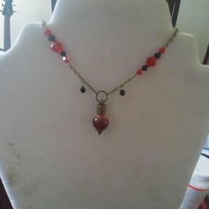 Vampire blood vial necklace. Halloween costume necklace. Blood vial necklace with 20 inch chain and red and black crystals