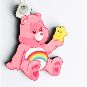 Care bears keyring, pin badge and (new) large magnet. Can be Personalised.