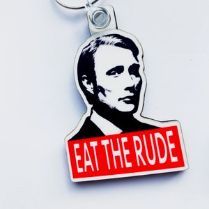 Hannibal eat The Rude keyring, pin badge and (new) large magnet. Can be Personalised.