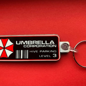 Umbrella Corporation - Resident Evil keyring, pin badge and (new) large magnet. Can be Personalised.