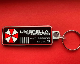 Umbrella Corporation - Porte-clés Resident Evil, badge et (nouveau) grand aimant. Peut être personnalisé.