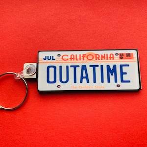 Outatime - Back To The Future keyring, pin badge and (new) large magnet. Can be Personalised.