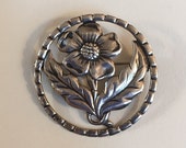 Vintage Sterling Silver Stamped Single Flower with Leaves in Round Decorative Frame Brooch