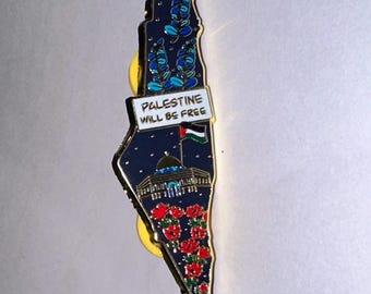 May include: A pin in the shape of Palestine, featuring a dark blue background with floral and architectural details. The pin includes the text "PALESTINE WILL BE FREE" and a Palestinian flag.