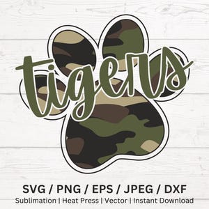 May include: A paw print design with a camouflage pattern, featuring the word "Tigers" in a green, cursive font. The design is outlined in black and white. The image includes text at the bottom: SVG / PNG / EPS / JPEG / DXF.